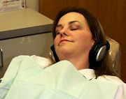 Comfortable Dental Patient using headphones.